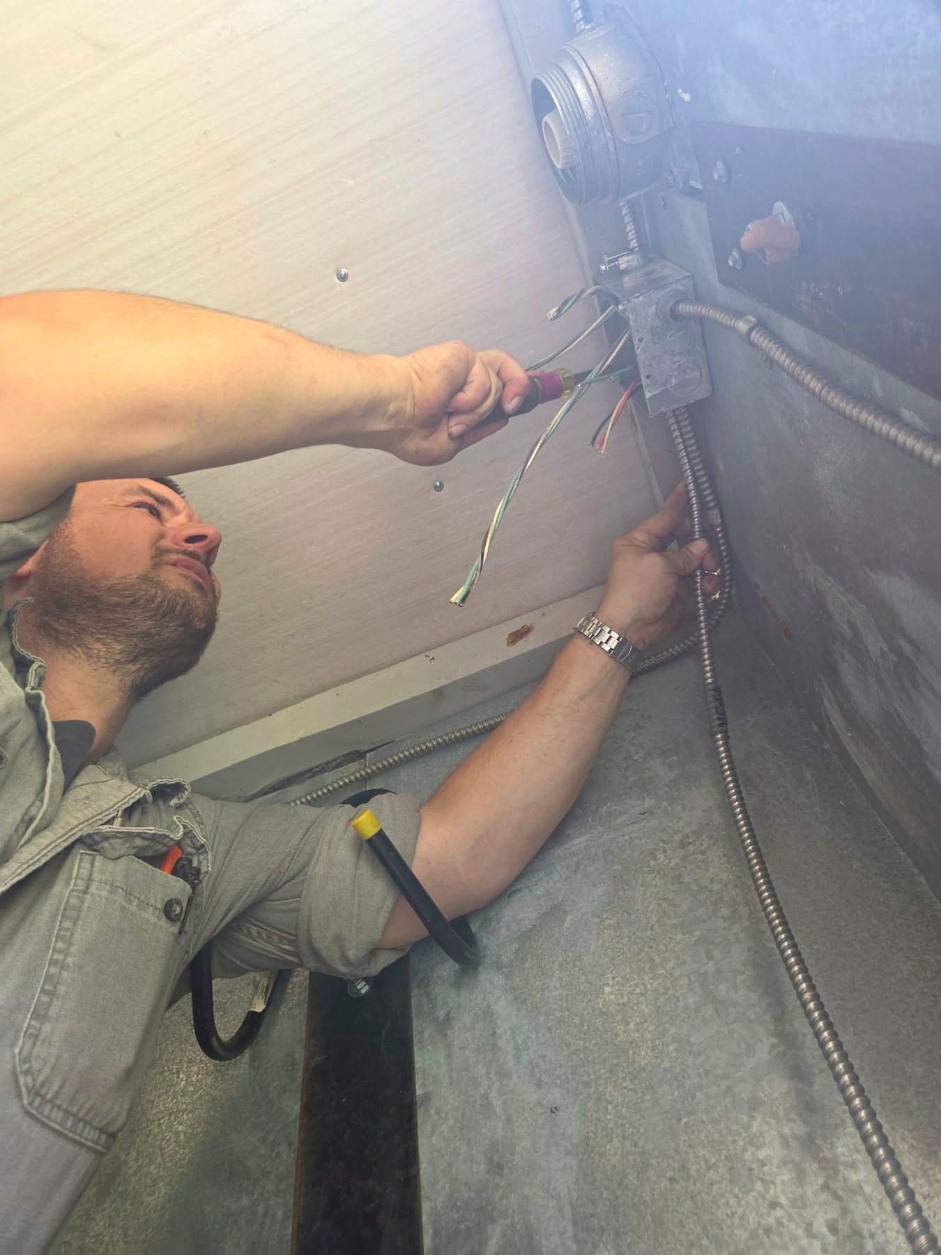 Clay Sims completing electrical work
