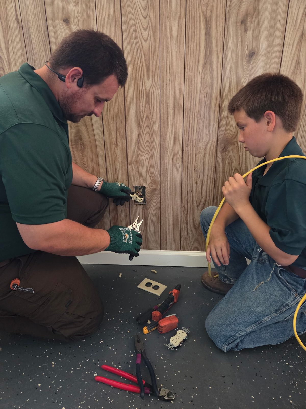 Clay Sims teaching electrical work in the family business